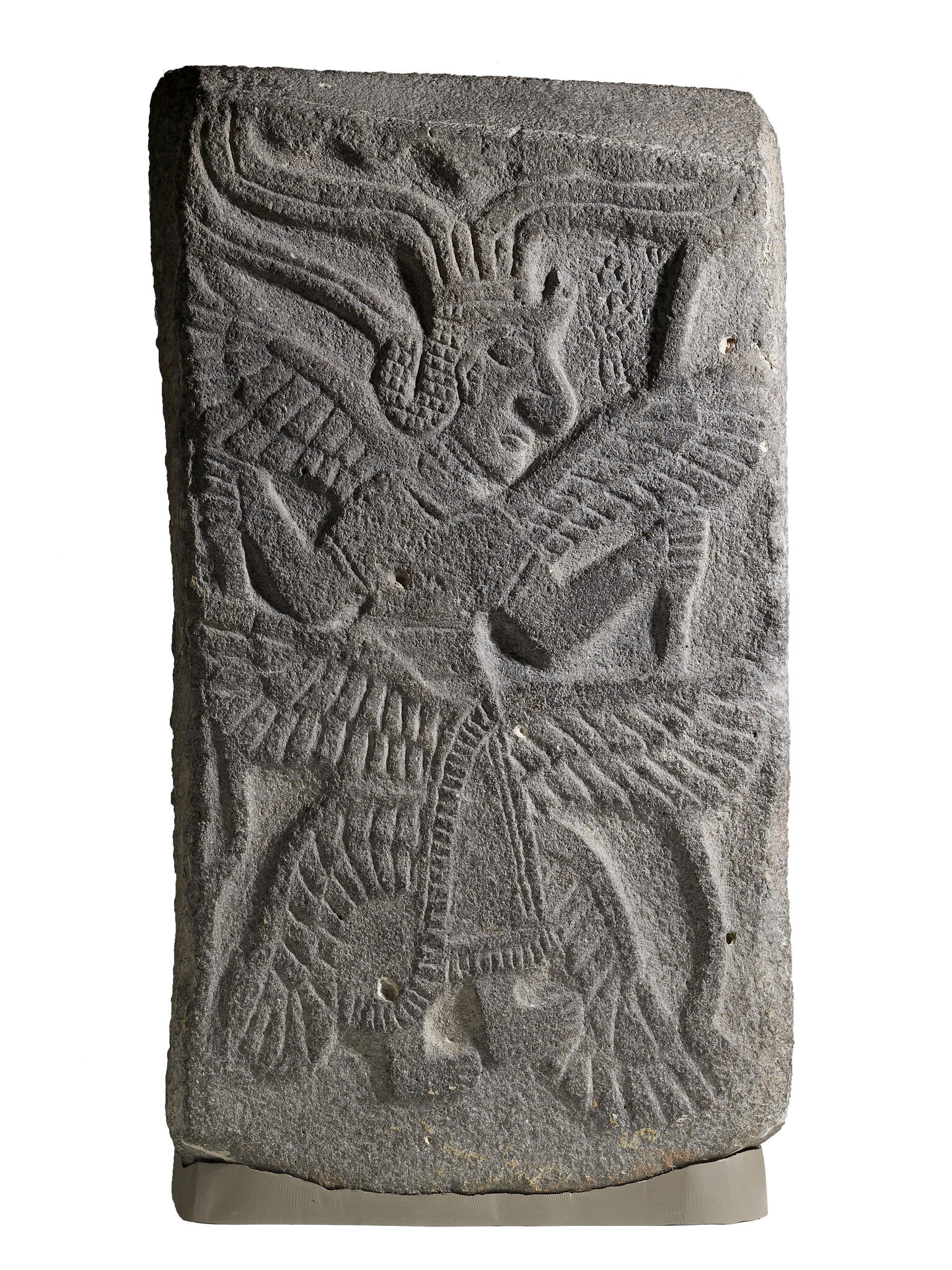 Relief of figure with six wings and headdress.