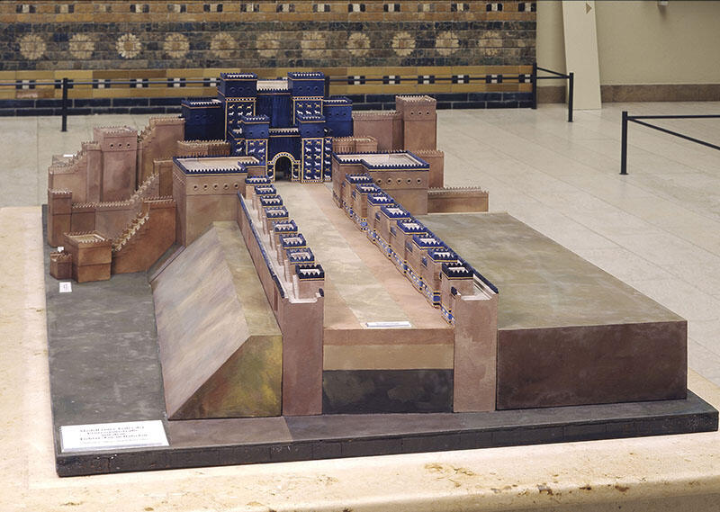 Model of temple and long avenue lined with small uniform buildings. Model of temple and long avenue lined with small uniform buildings.