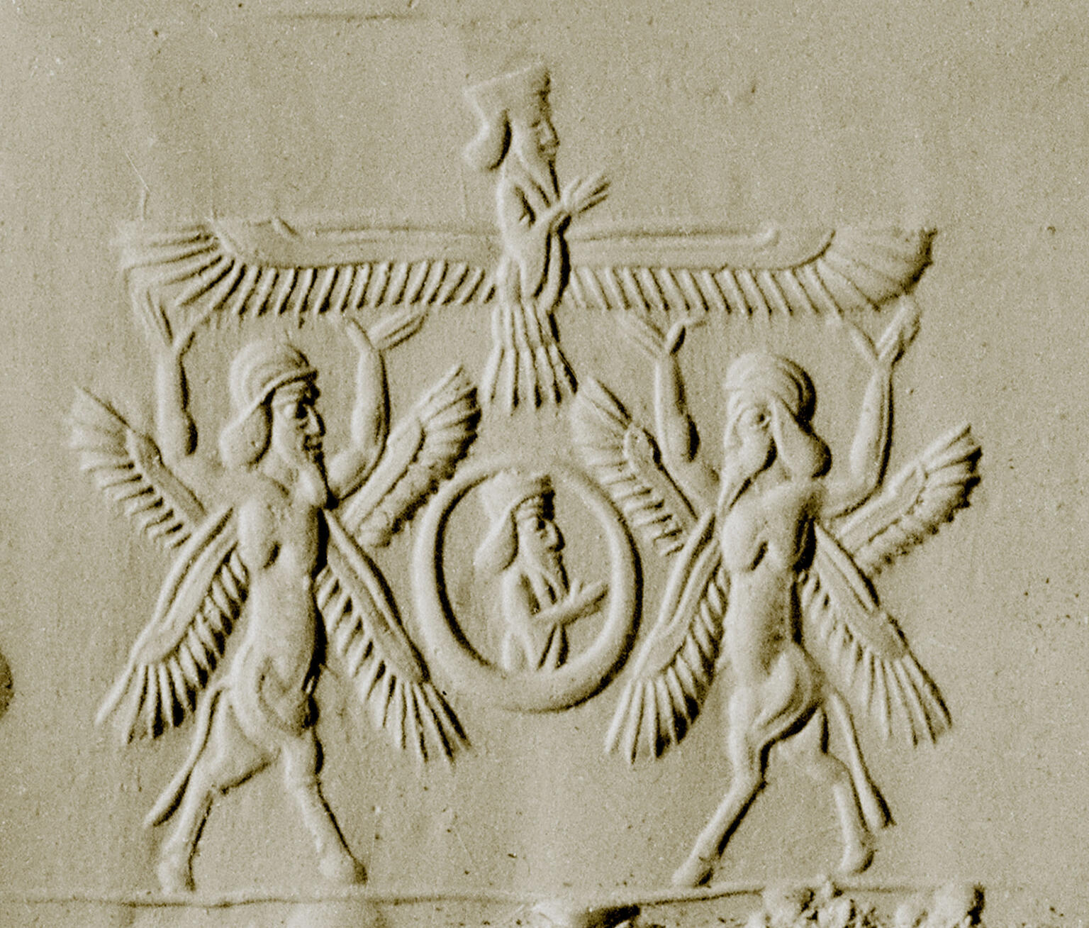 Impression of two winged figures holding up a third winged figure.