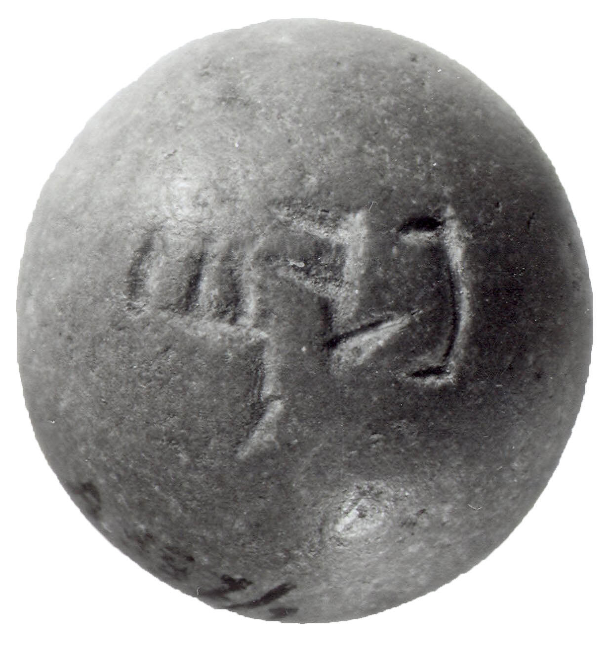 Dome-shaped stone weight with Hebrew inscription. Dome-shaped stone weight with Hebrew inscription.