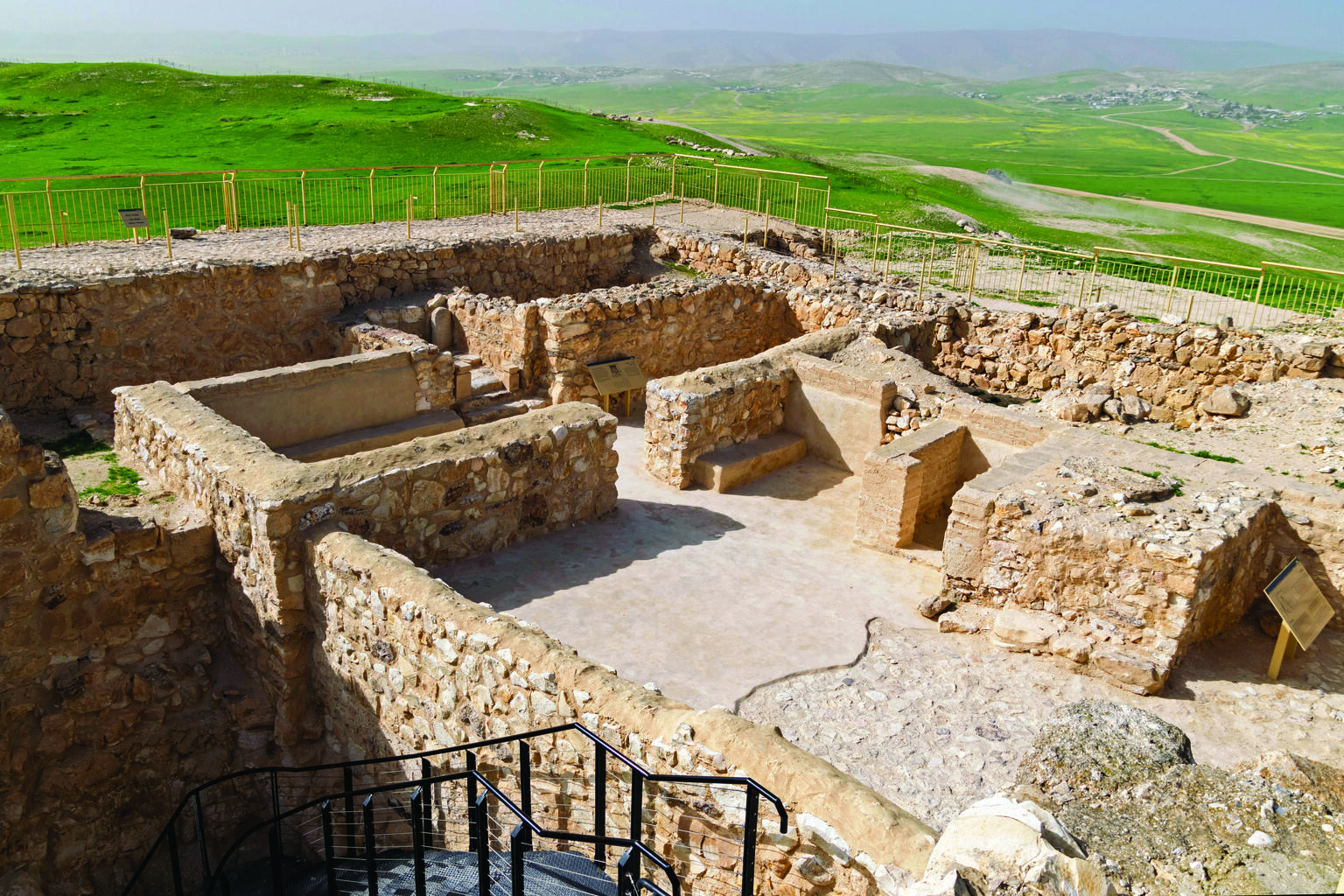 Photograph of ruins of stone buildings.