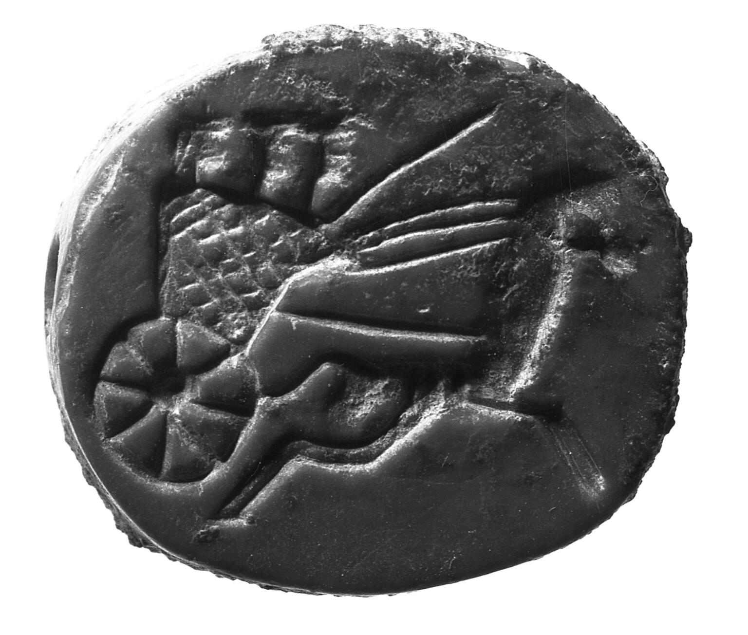 Limestone seal with image of driver and two people in a horse-drawn chariot.