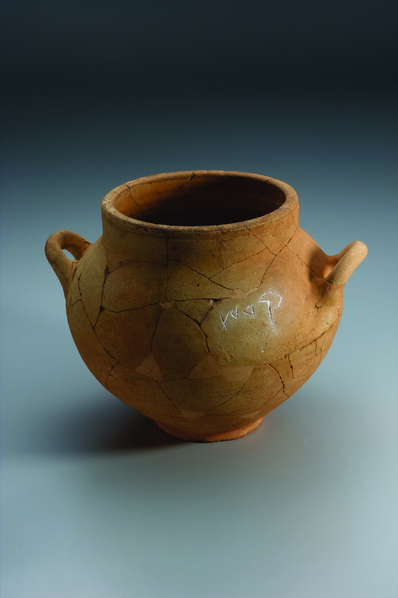 Ceramic pot with two handles and Hebrew inscription.