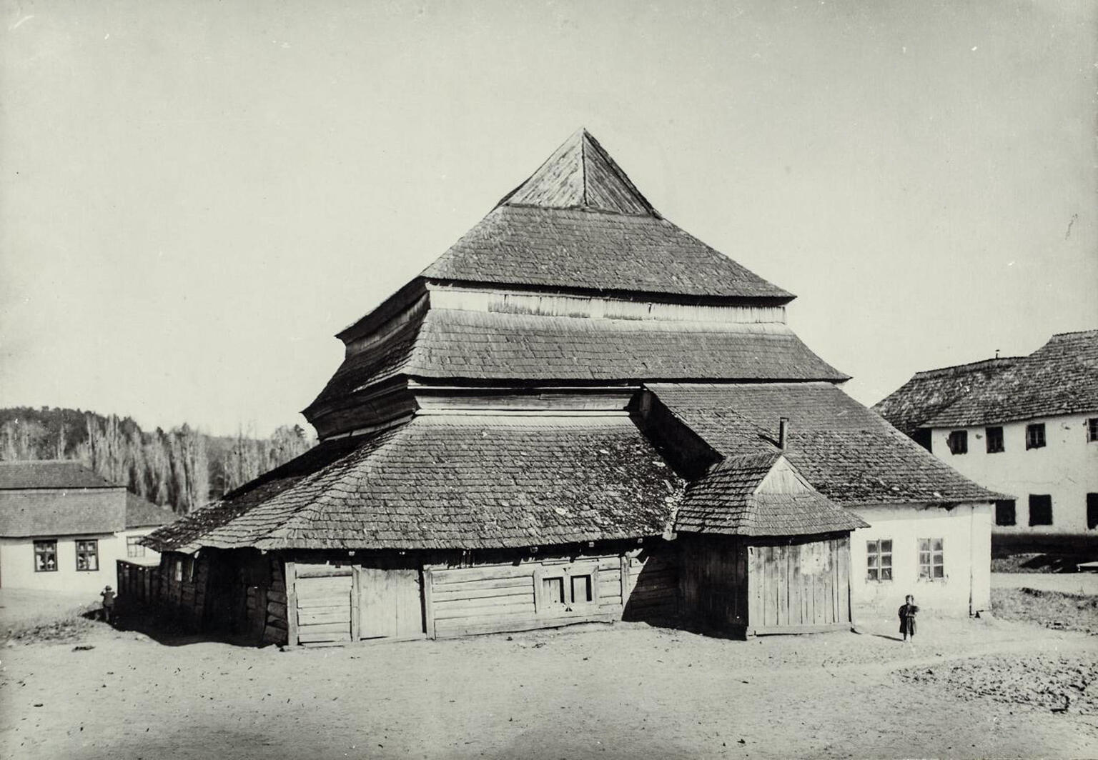 Photograph of wooden building exterior with several layers of roofs. Photograph of wooden building exterior with several layers of roofs.