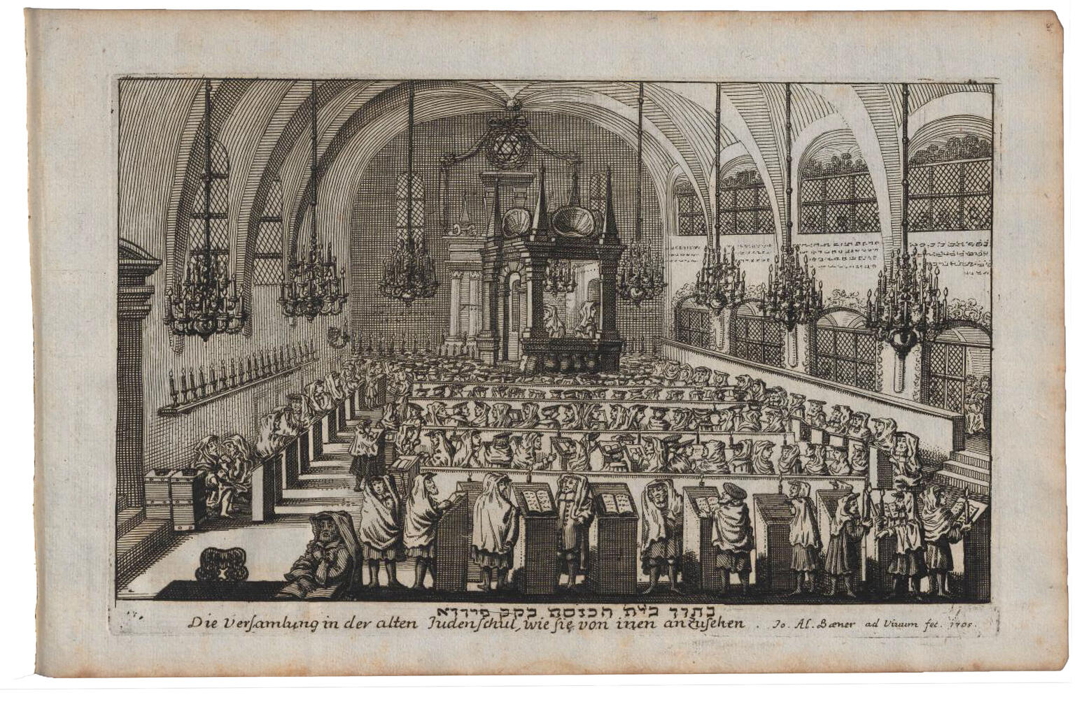 Print engraving of large room with rows of pews with men in prayer shawls standing with books, vaulted ceiling, many chandeliers, and raised platform along far wall. Print engraving of large room with rows of pews with men in prayer shawls standing with books, vaulted ceiling, many chandeliers, and raised platform along far wall.