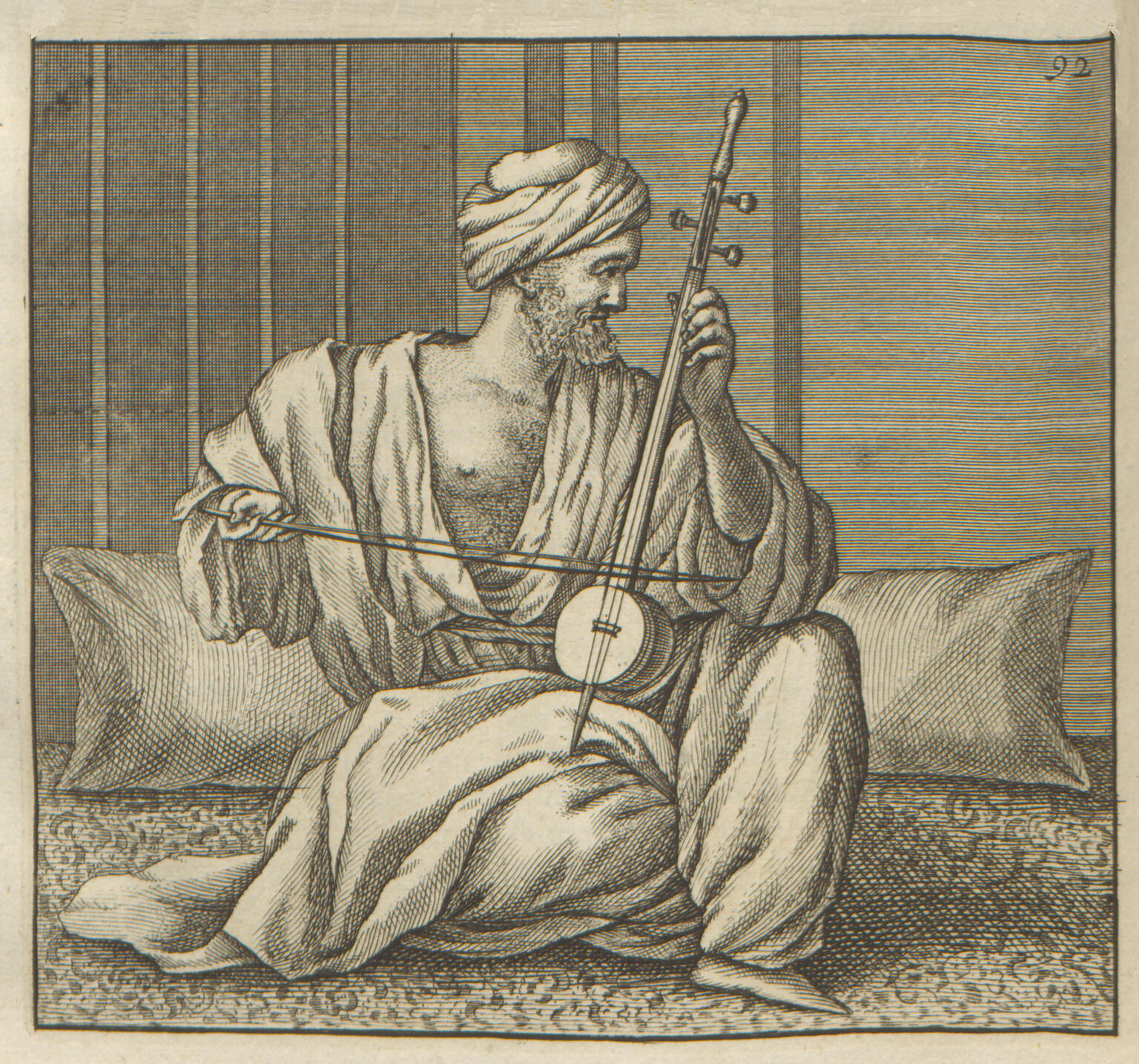 Print depicting man in turban and draped robe sitting amid pillows and playing instrument with bow.