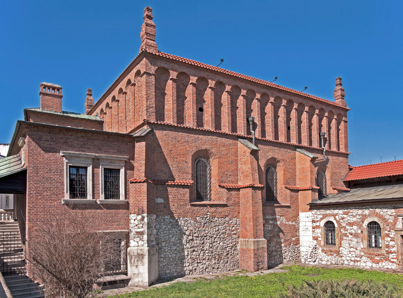 Exterior photograph of brick building of high niches.