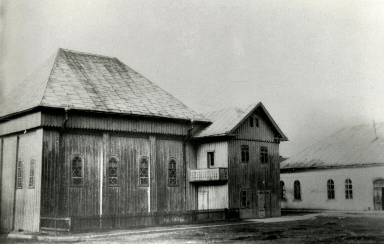 Exterior photograph of wooden building. 