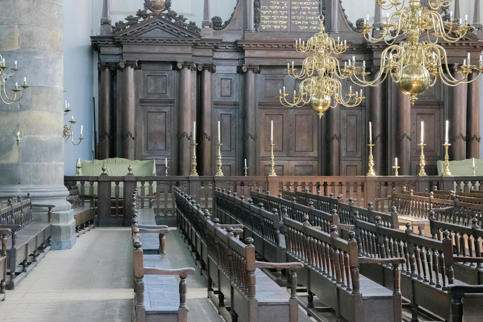 Photograph of room with wooden pews. Photograph of room with wooden pews.