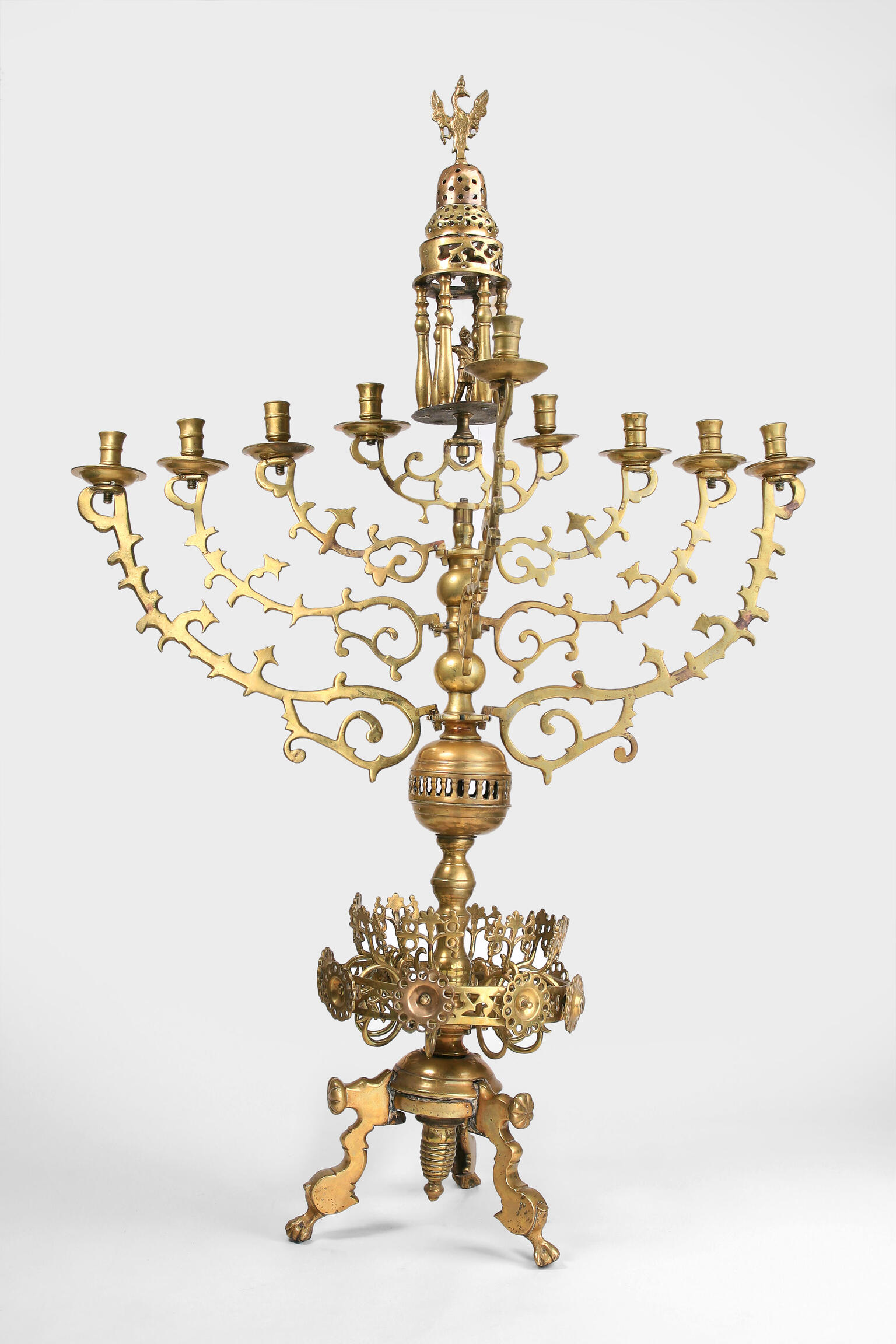 Nine-branched candelabrum with small carved eagle on top and crown shape on base. Nine-branched candelabrum with small carved eagle on top and crown shape on base.