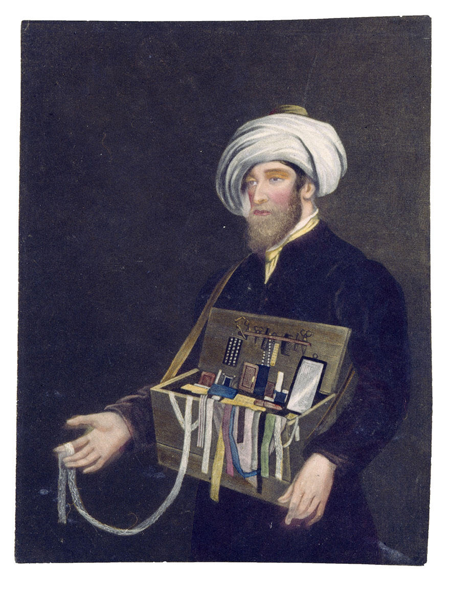 Mezzotint of peddler in turban presenting box of objects.