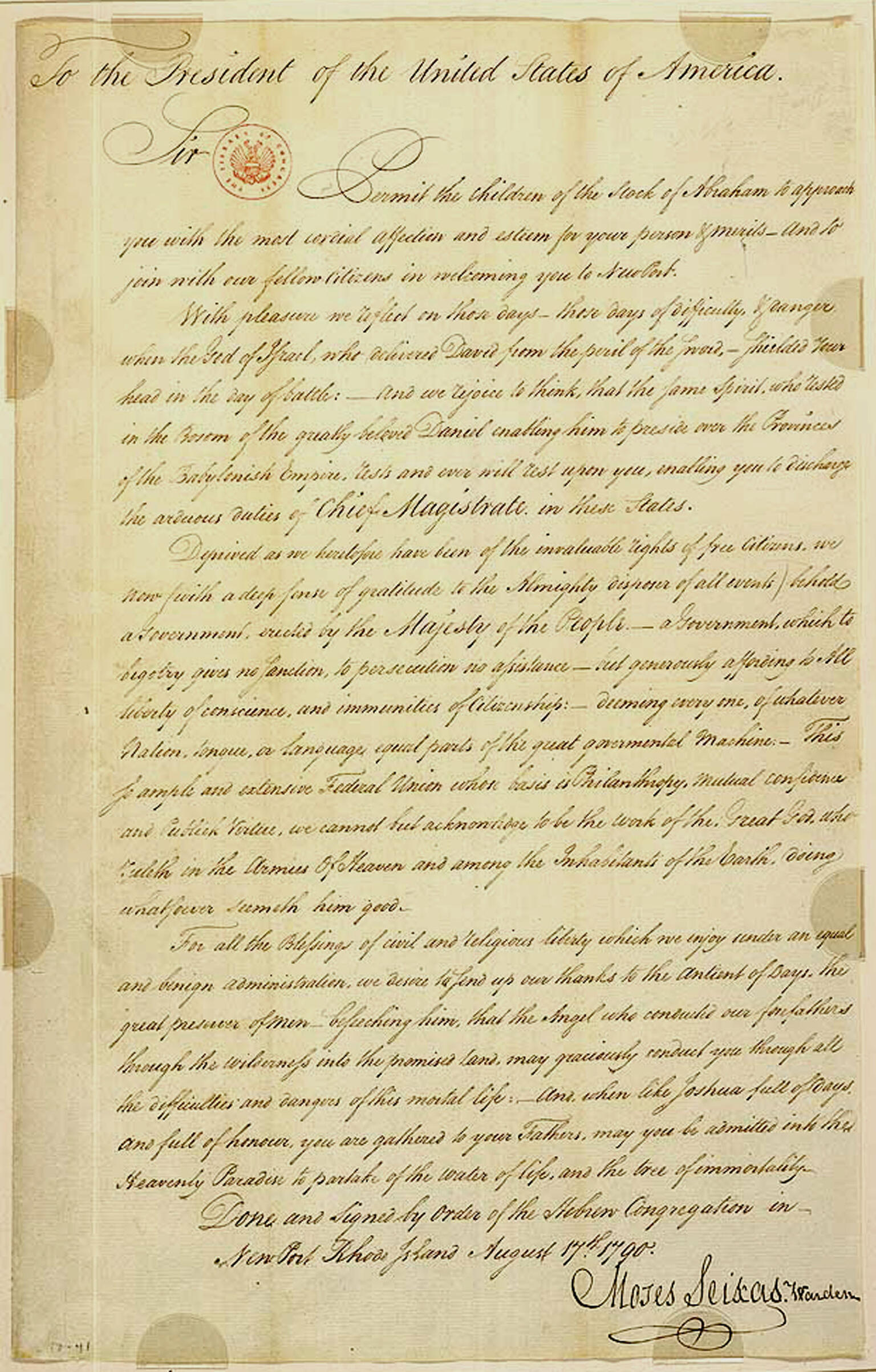 Handwritten letter in English with small stamp at top and signature on bottom.