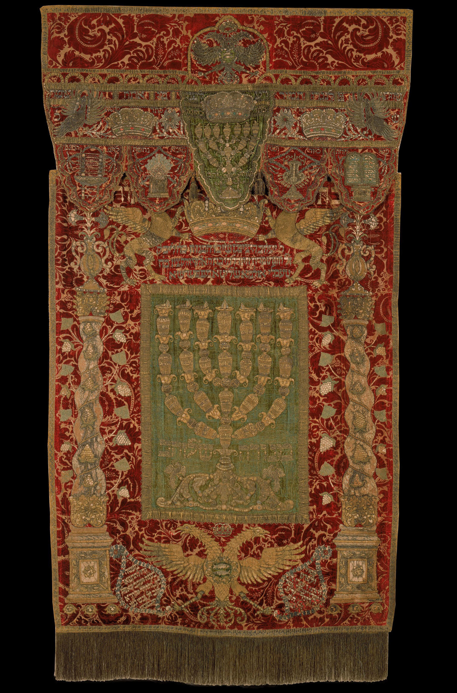 Embroidered curtain and valence bearing three crowns and five vessels.