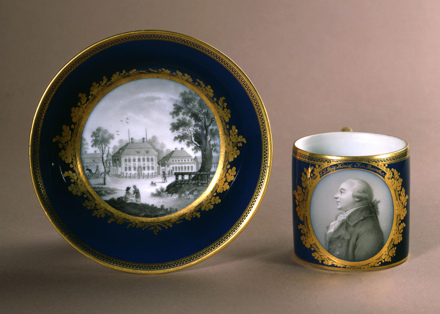 Cup and saucer picturing man in profile on cup and his home on the center of the plate. 