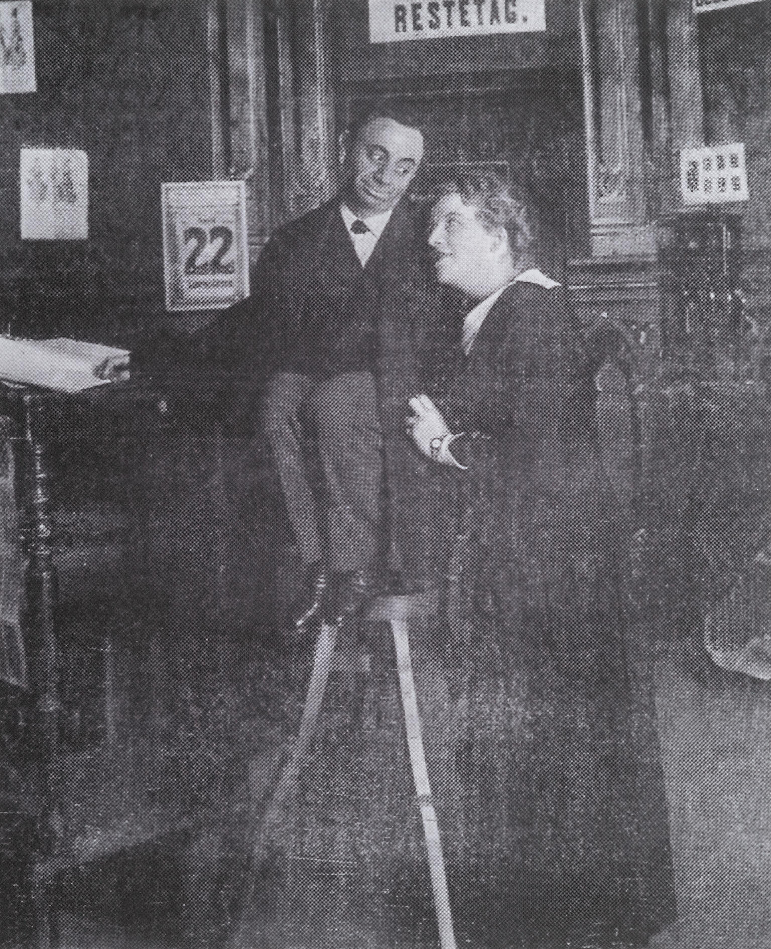 The Double Accountant Photograph of two figures looking at each other.