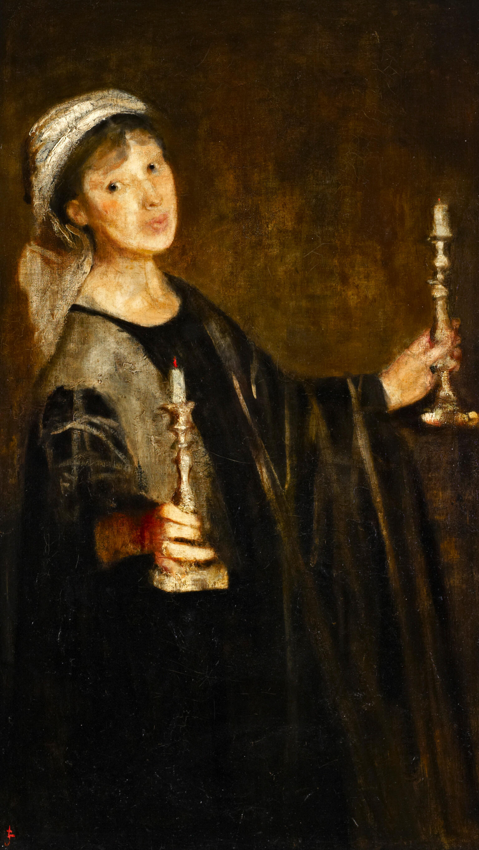 Portrait of woman holding candles.