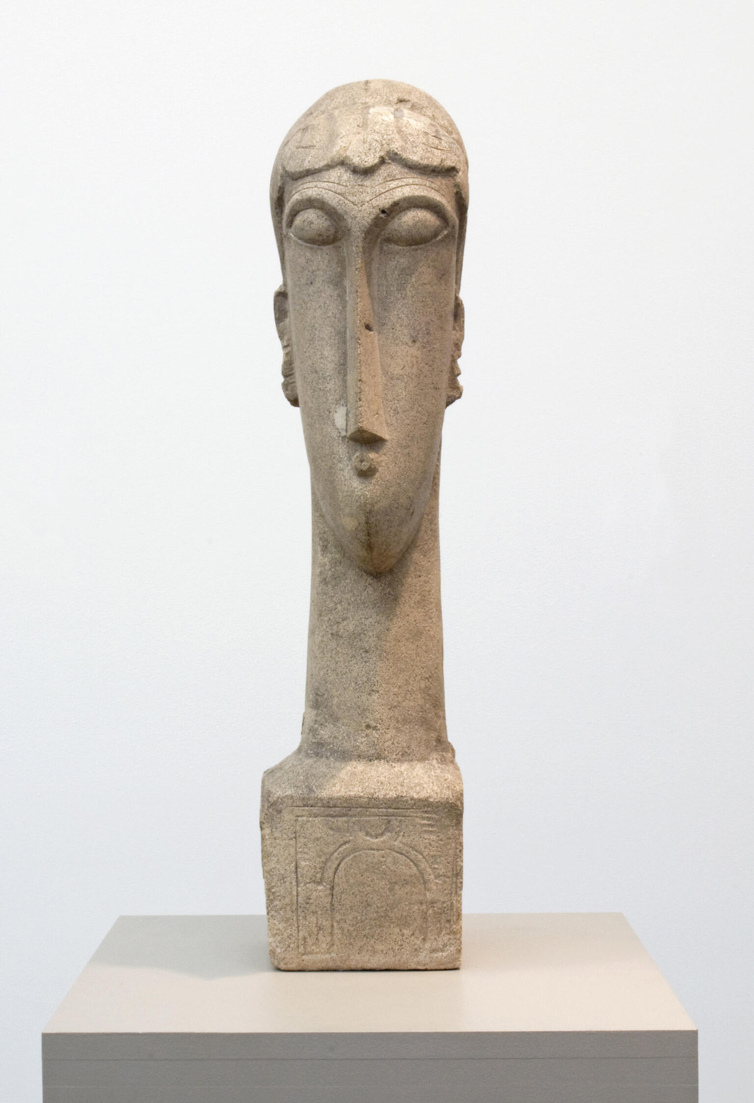 Sculpture of elongated head and neck.