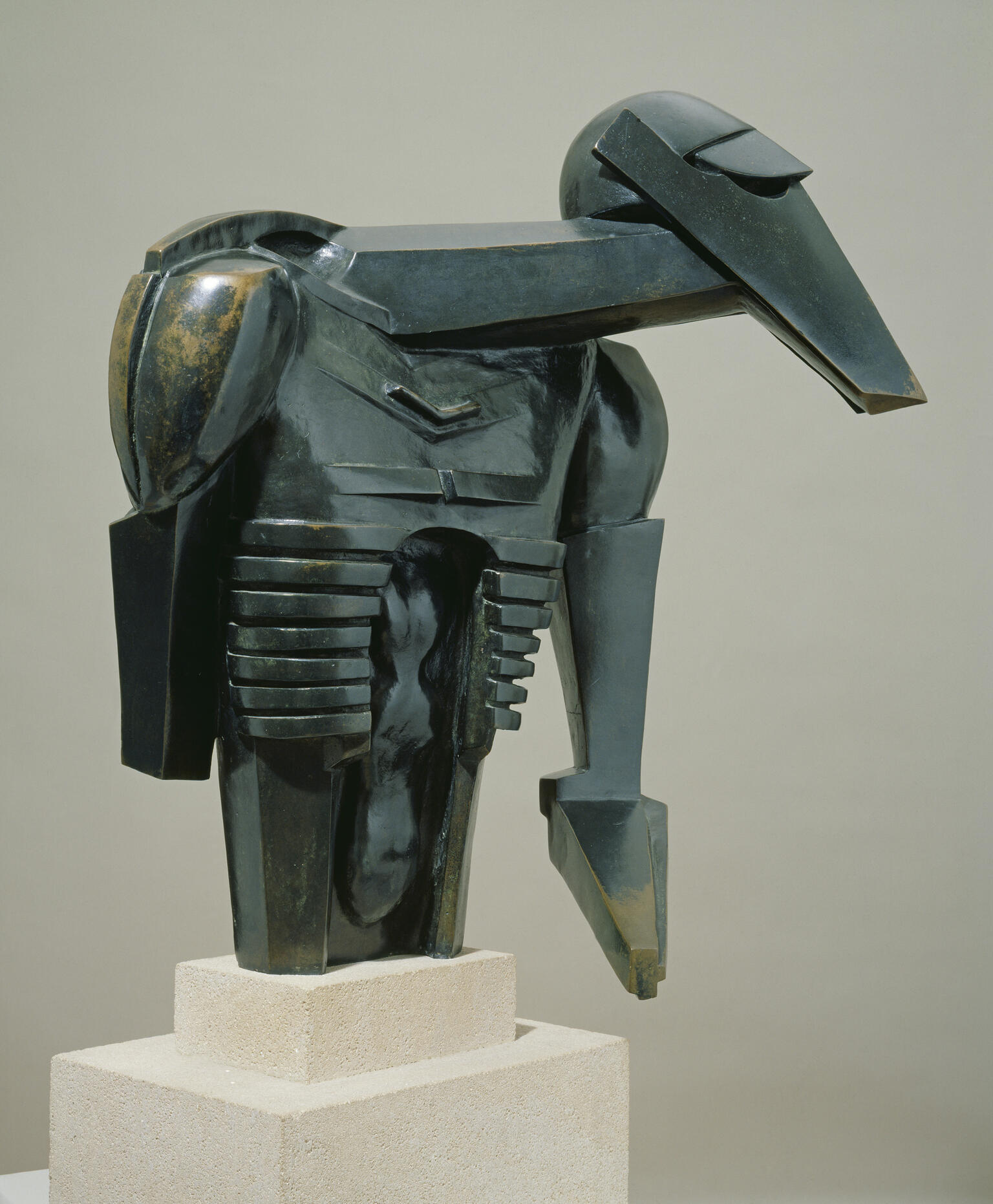 Bronze sculpture of angular shapes resembling a torso.