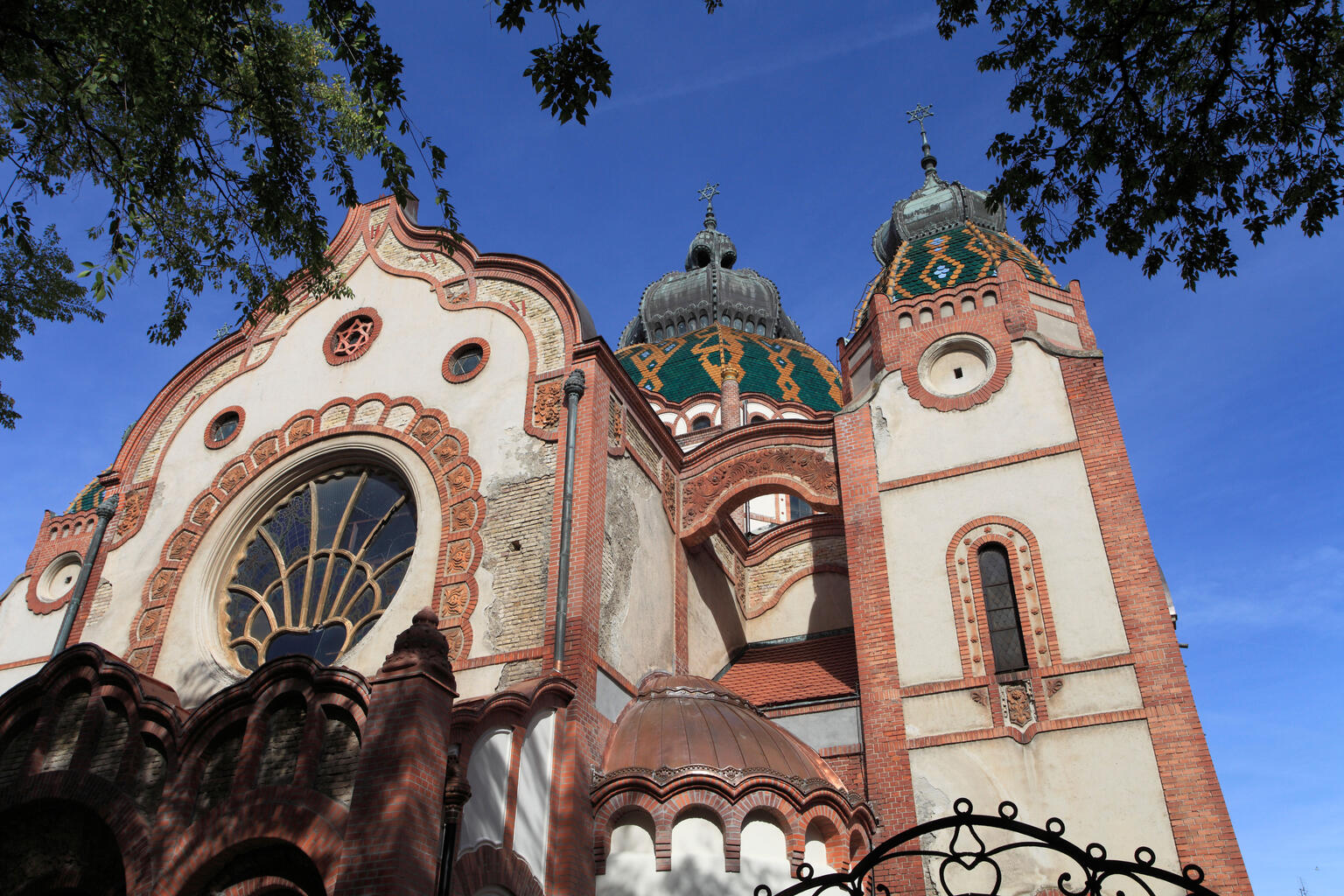 Photograph of building exterior with rounded roofs