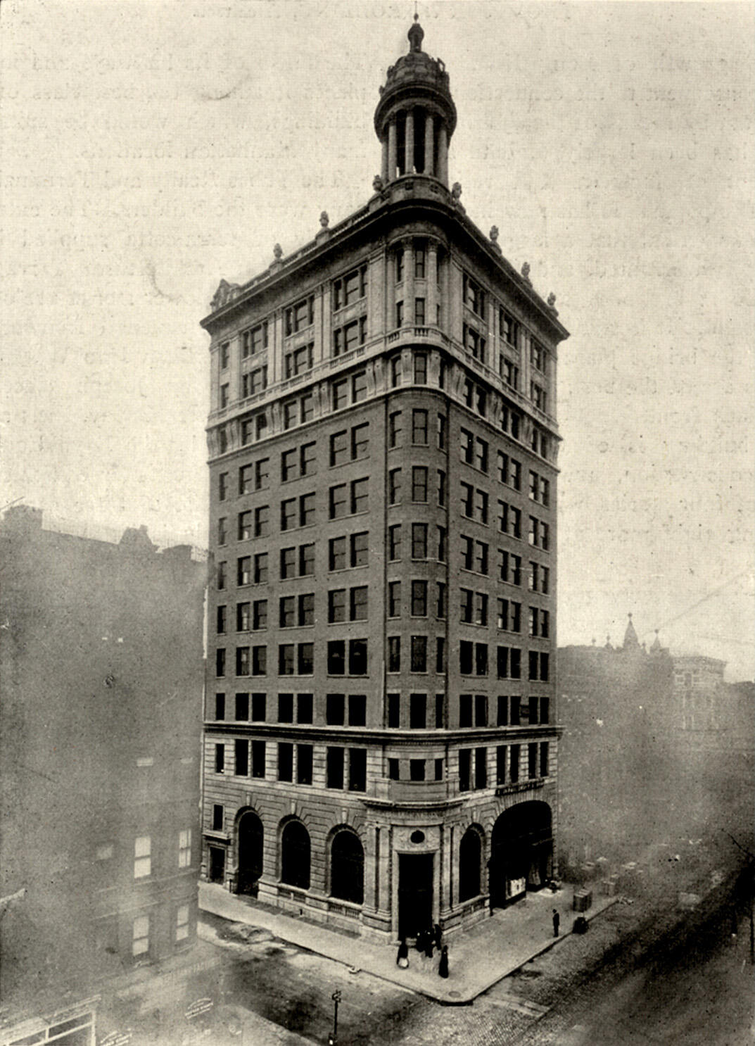 Photograph of tall building with many symmetrical windows.