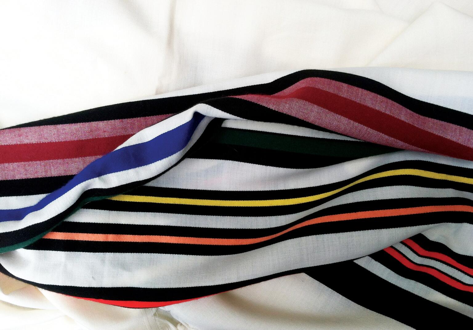 Prayer shawl woven with bands of vibrant colors. Prayer shawl woven with bands of vibrant colors.