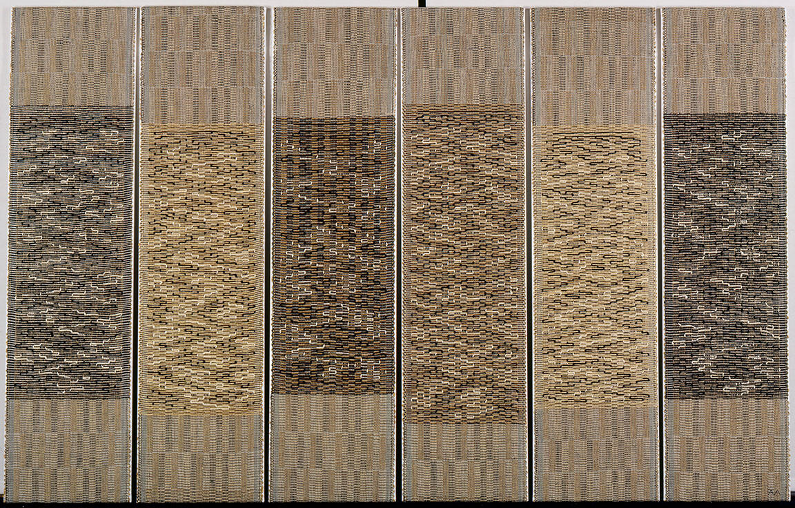 Six vertical tapestries woven in patterns in similar shades.