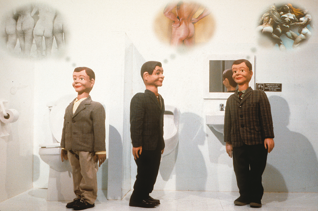 Three dolls in a bathroom with thought bubbles above their heads with images of multiple perspectives of the human buttocks. 