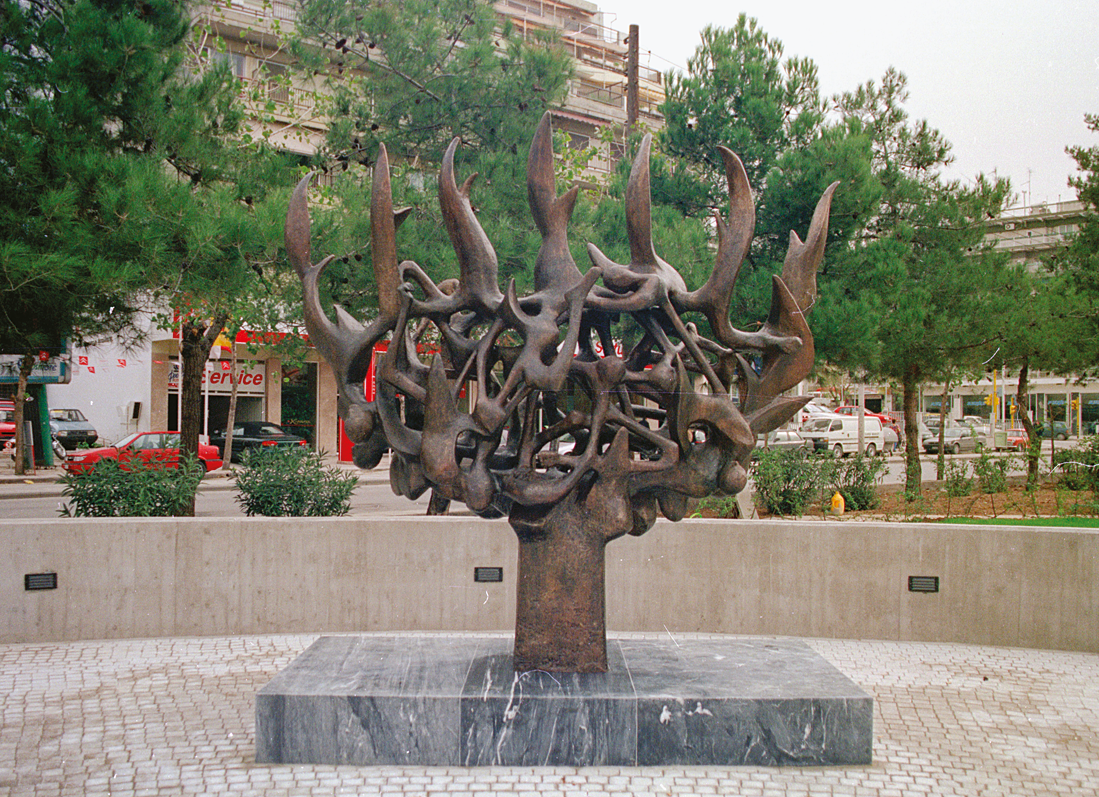 Sculpture depicting abstract tree with entangled branches in the middle of city square. Sculpture depicting abstract tree with entangled branches in the middle of city square.