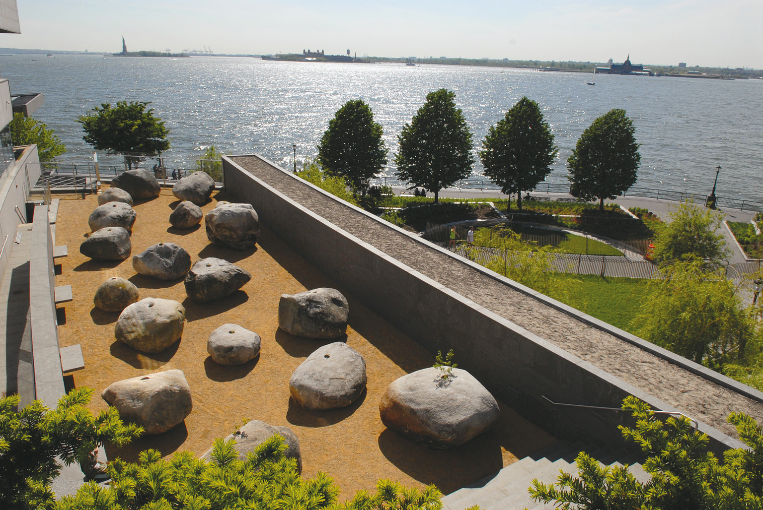 Aerial photograph of rock garden next to a building overlooking the sea. Aerial photograph of rock garden next to a building overlooking the sea.
