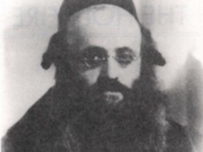 Black and white image of an Orthodox Jewish man wearing spectacles.