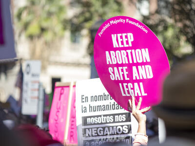 Signs at an abortion rights rally.