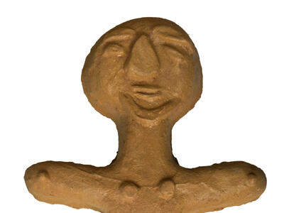 Sculpture of human-like figure.