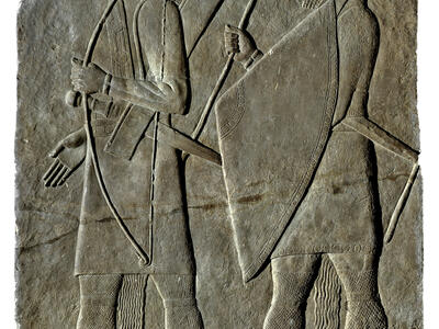 Relief with one archer holding bow and soldier with large triangular shield.