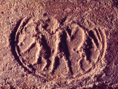 Seal Impression of a Male Figure Holding Two Caprids Seal impression with figure holding two ibex-like animals.