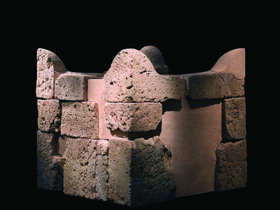 Reconstructed stone altar with horns at four upper corners.