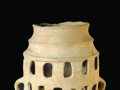 Ceramic offering stand with four rows of windows and small protruding feet with five toes on the bottom row of windows.