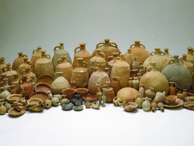 Assemblage of Containers from Ketef Hinnom Collection of many ceramic containers including bowls, bottles, decanters, jugs, and oil lamps.