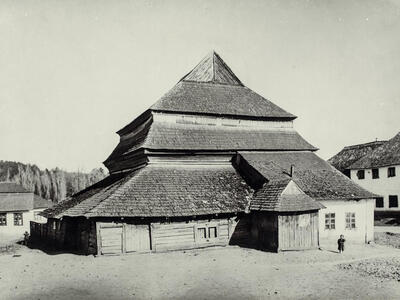 Gwoździec Synagogue, Galicia Photograph of wooden building exterior with several layers of roofs.