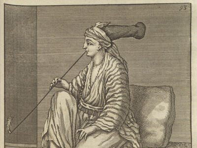 Print of seated person in large hat and robes facing to the left smoking a very long pipe. 