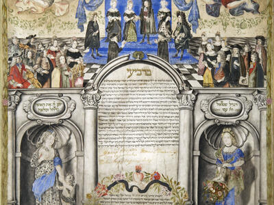 Page of Aramaic text surrounded by ornate illustrations, including couple under wedding canopy at the top of the page with many well-dressed people around them and two angels flying overhead, and two women on pedestals on either side of the bottom of the page on either side of a wreath with text inside. 