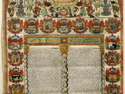 Page of Aramaic text with illustrations surrounding it, including heraldic shields around the text and a city, vines, flowers, and birds above text. 