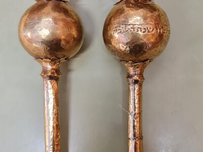 Two finials with Hebrew inscription on one. 