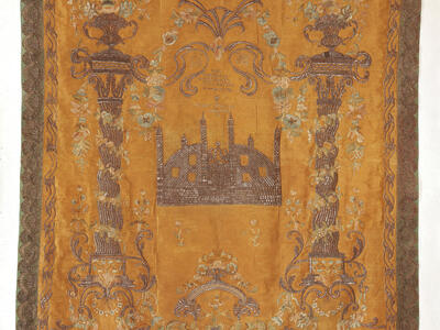 Cloth embroidered with columns on either side and building in the middle with turrets and dome, with small Hebrew inscription above. 
