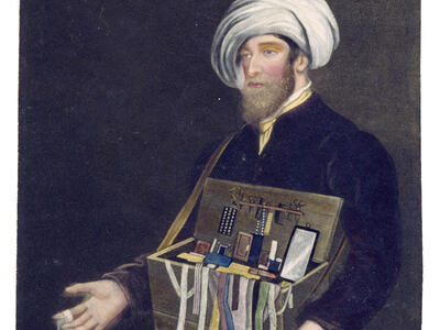 Mezzotint of peddler in turban presenting box of objects.