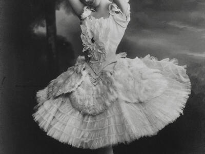 Photograph of ballerina on pointe wearing tutu.