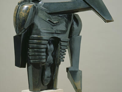 Bronze sculpture of angular shapes resembling a torso.