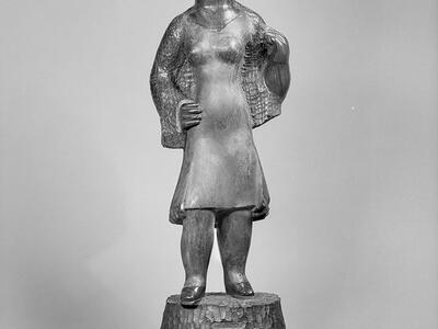 Sculpture of woman wearing dress and hat looking to her left.