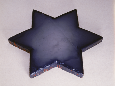 Sculpture of solid Star of David. 