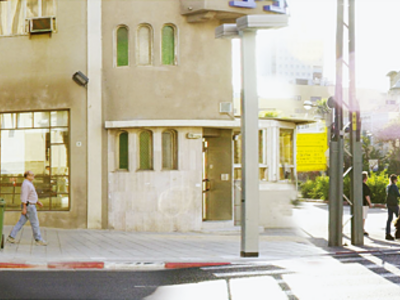 Panoramic photograph depicting street view and buildings.