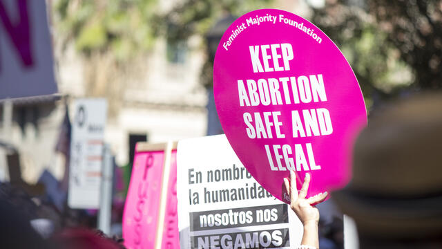 Signs at an abortion rights rally.